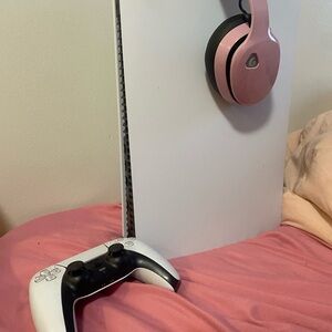 Gaming Console with Controller and Headphones